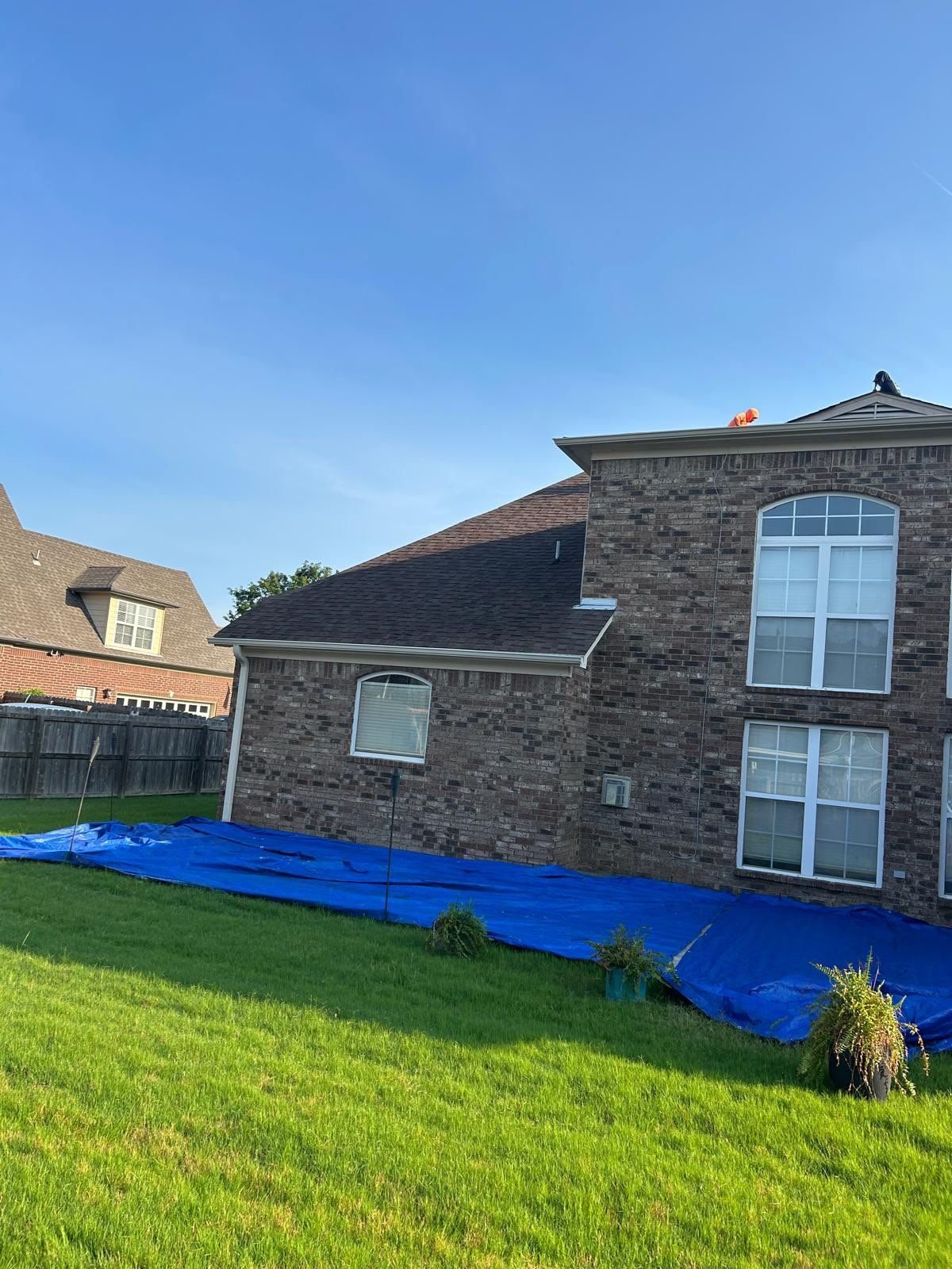 Tarps protecting the yard during a roof replacement in Arlington TN