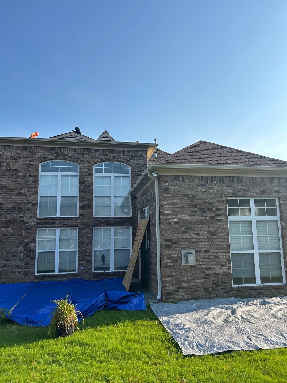 Roof replacement on a two-story brick home in Arlington TN