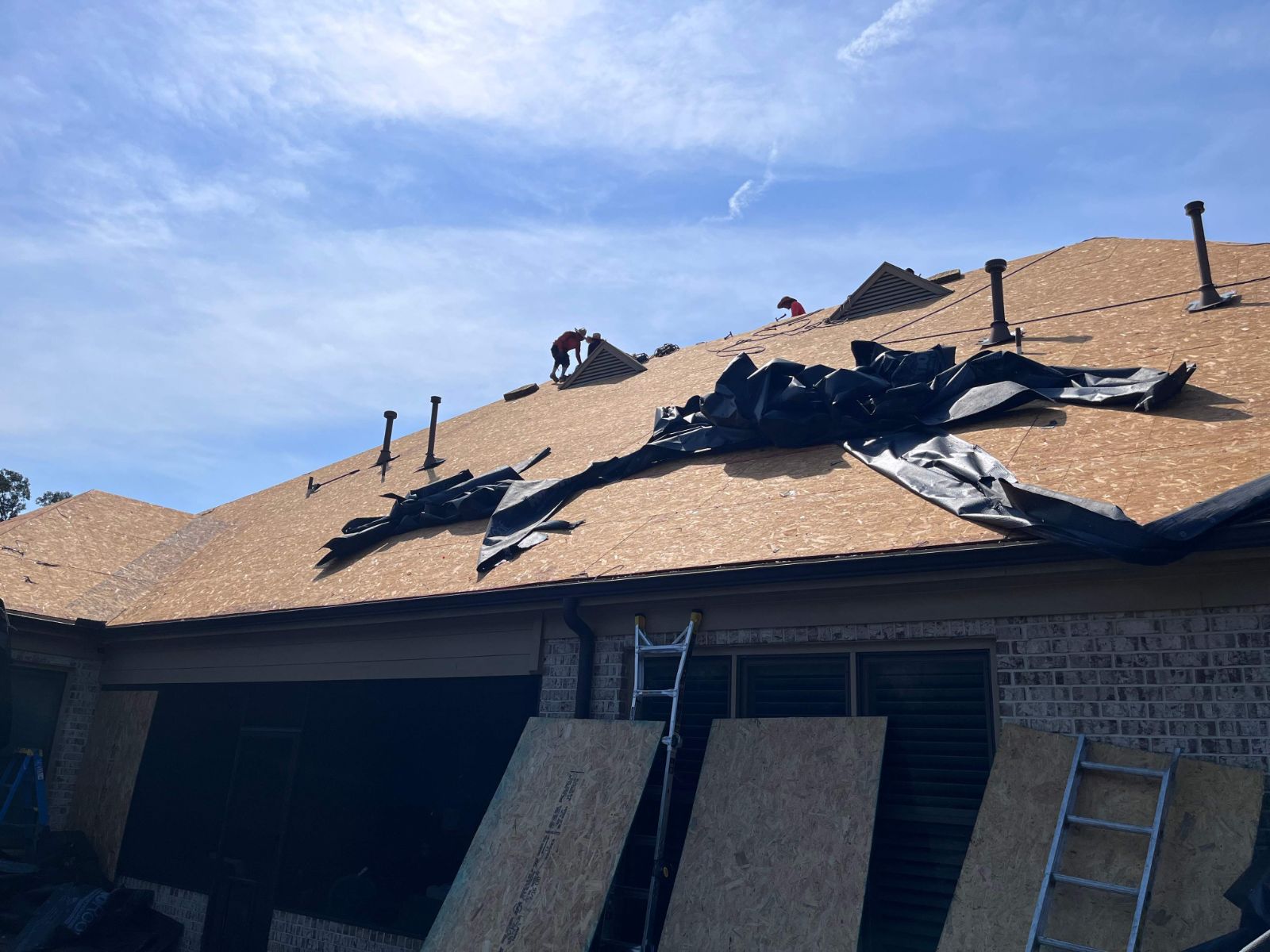 Crew tearing off the old roof on a Collierville TN home