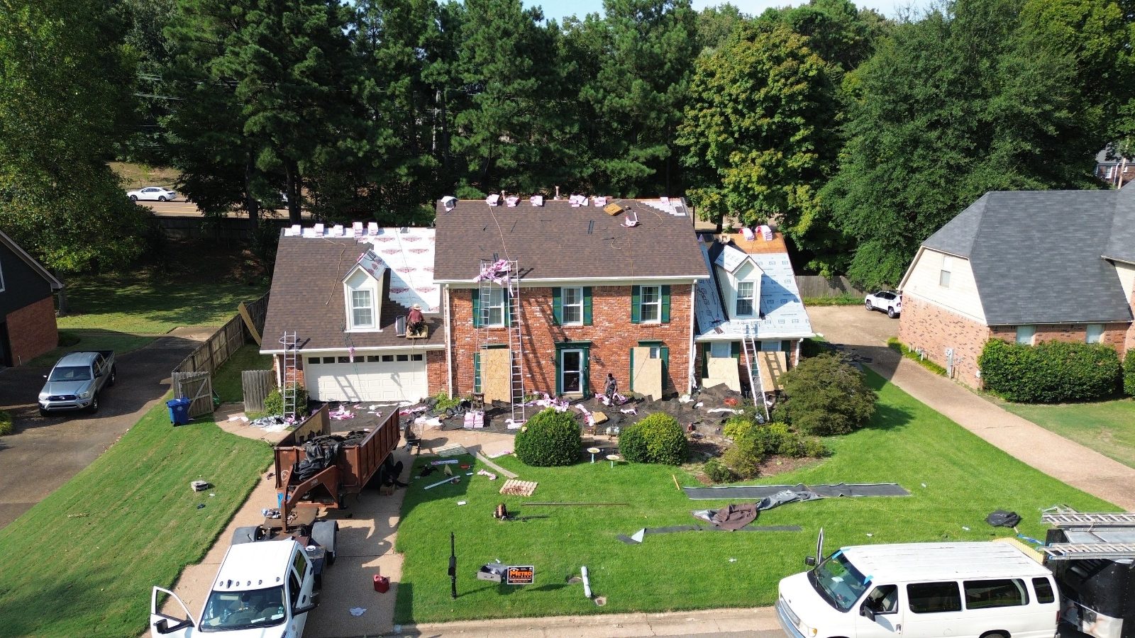 Metro Builders crew and dumpster on site for a Germantown TN roof replacement