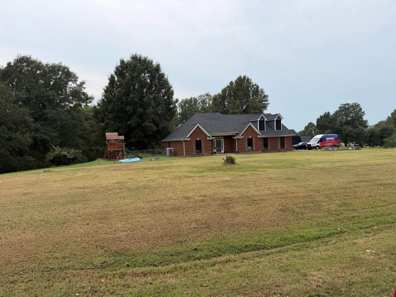 Brick home on a large lot in Hernando MS after a roof replacement