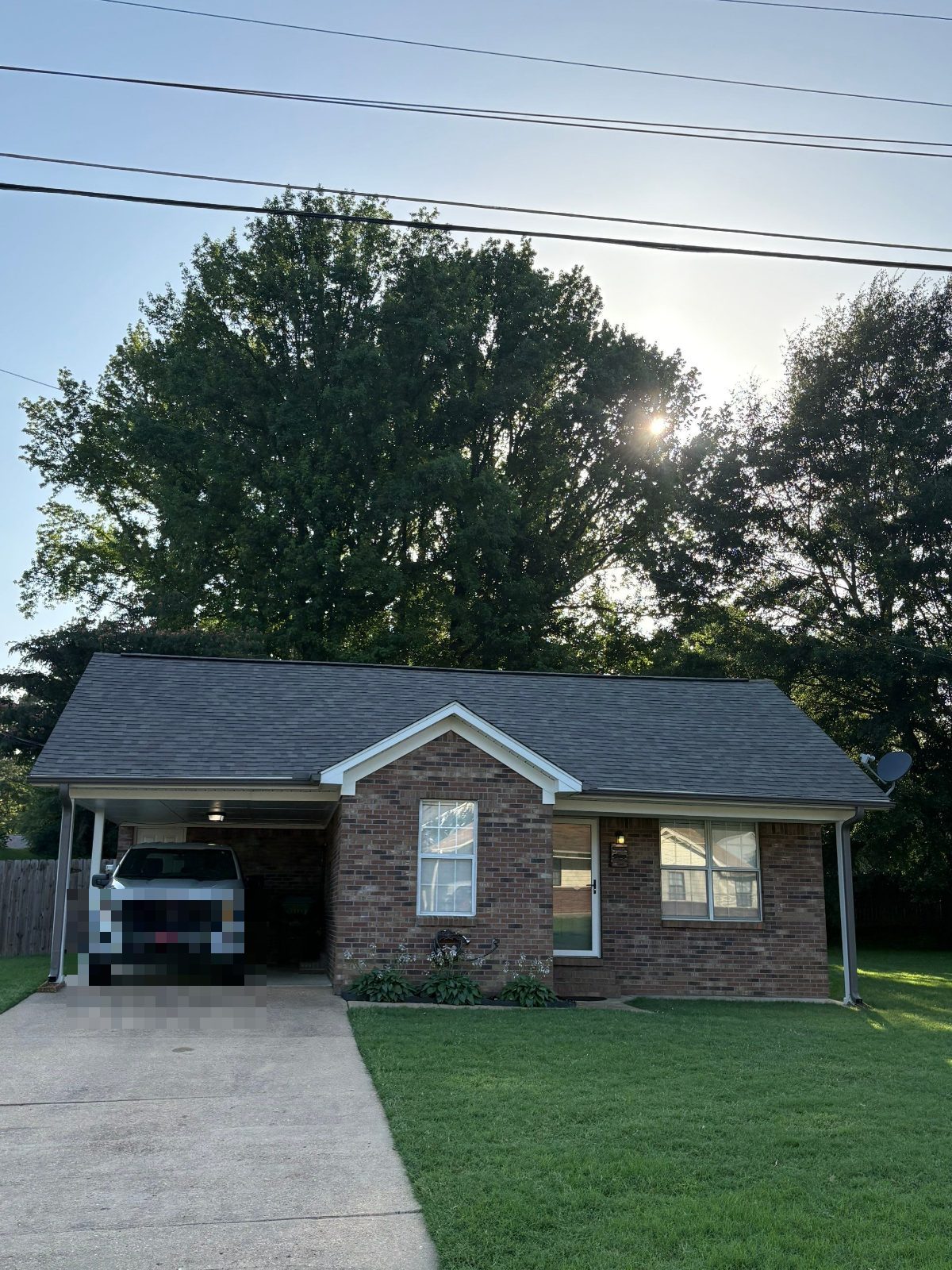 Completed roof replacement on a brick home in Munford TN