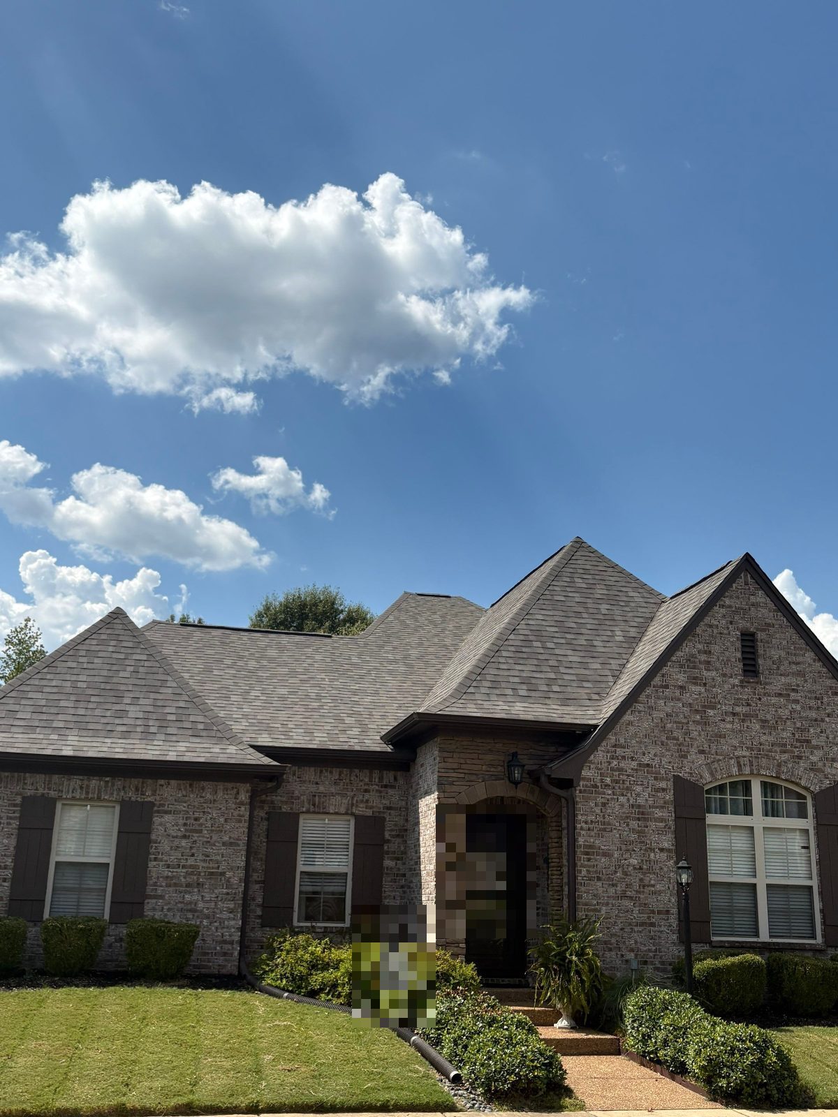 Completed roof replacement on a brick home in Lakeland TN