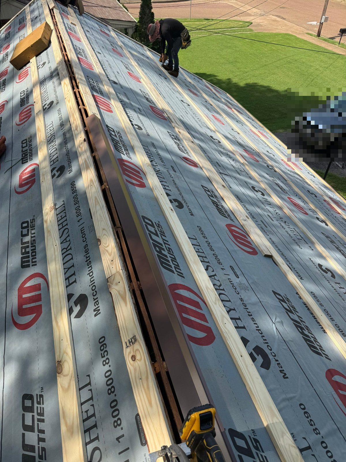 Wood battens over synthetic underlayment for a metal roof in Bartlett TN