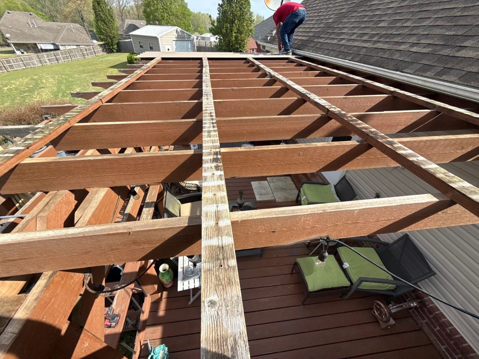 Open pergola framing over a deck before it was roofed in Millington TN