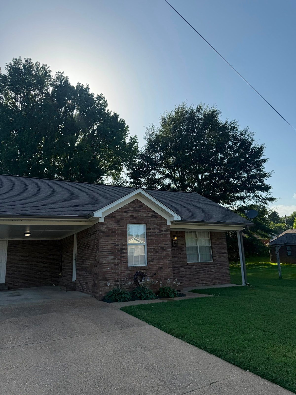 New shingle roof over the carport on a Munford TN home