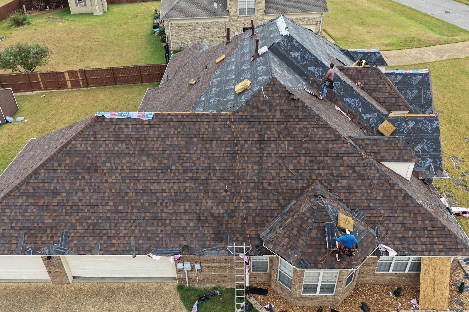 Drone view of underlayment and new shingles on a hip roof in Olive Branch MS